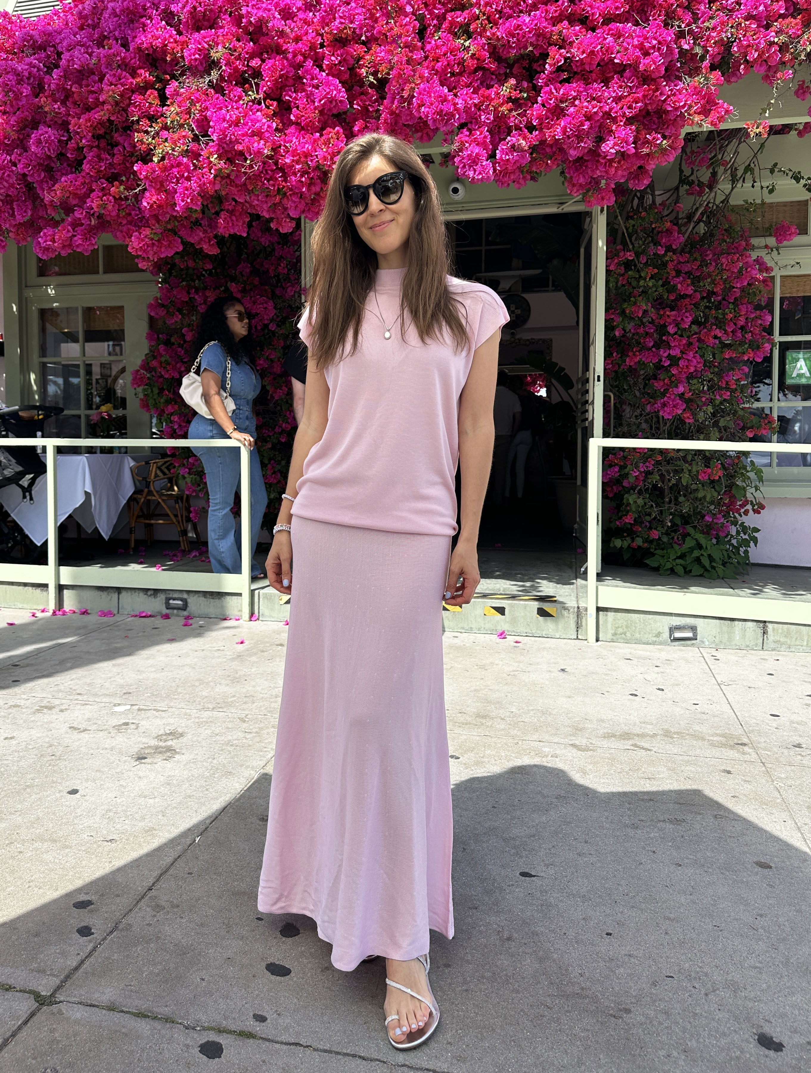 Woman in pink matching skirt set