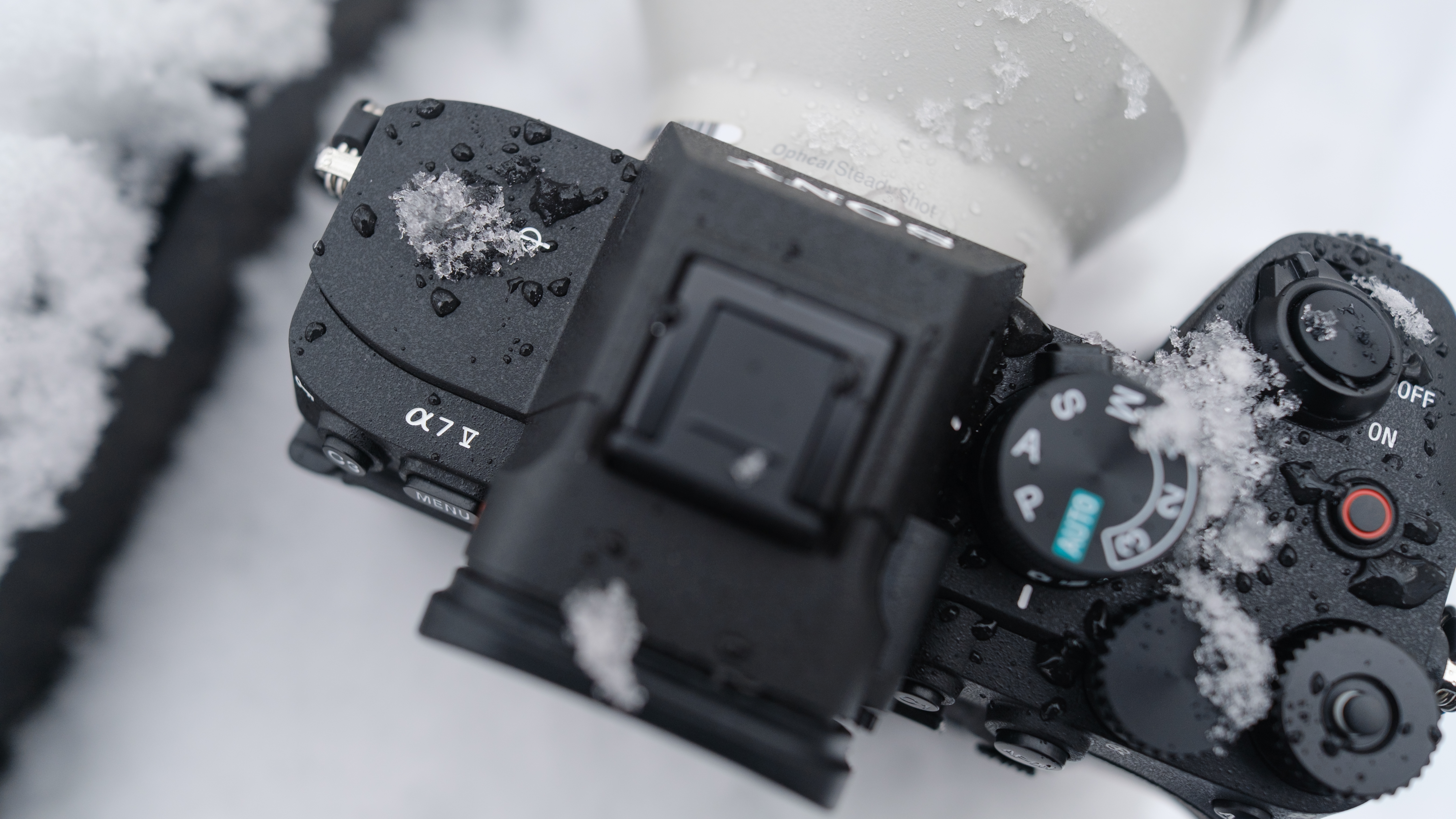 The Sony A7 V covered in snow