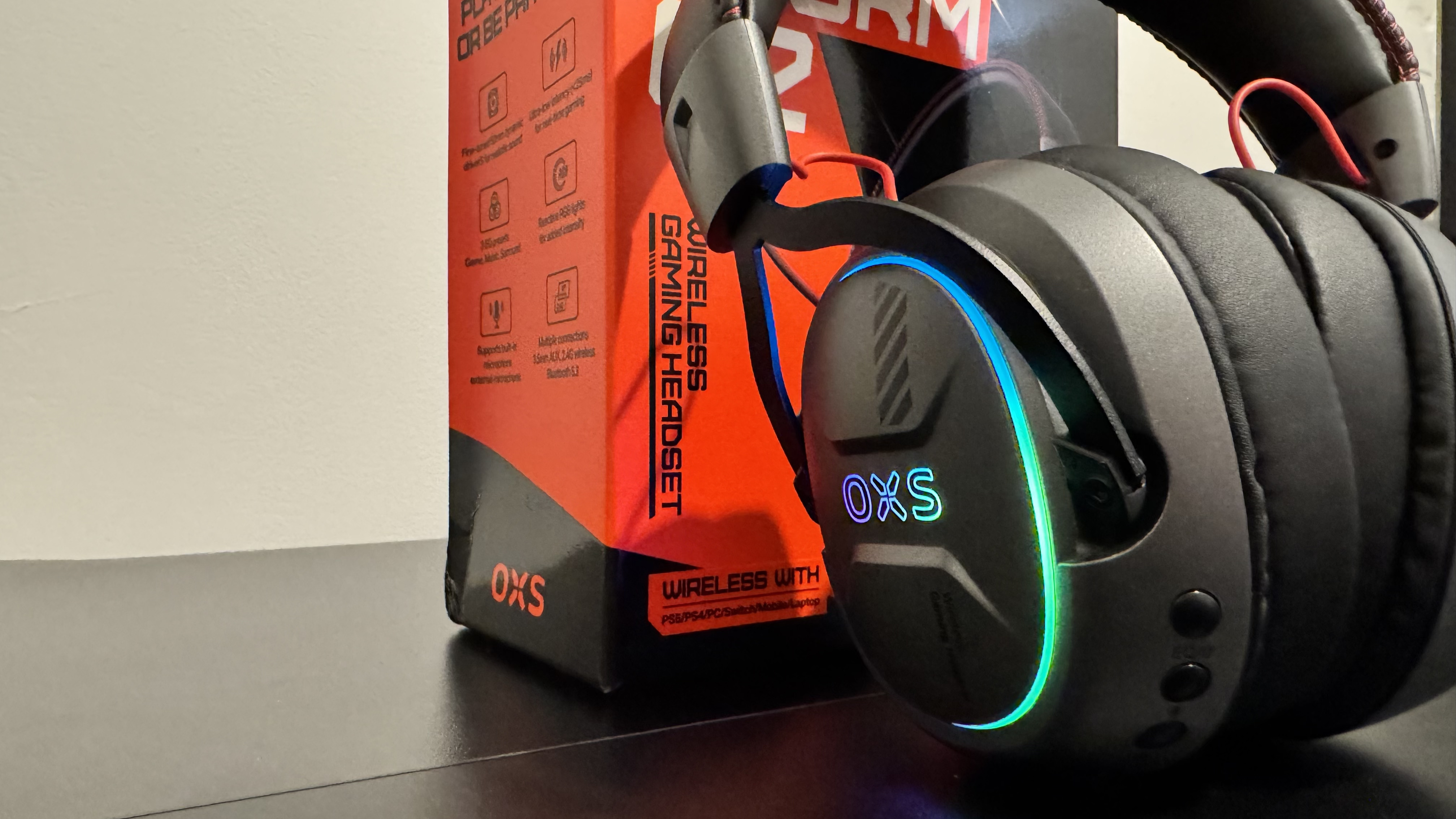 The OXS Storm G2 gaming headset on a black table