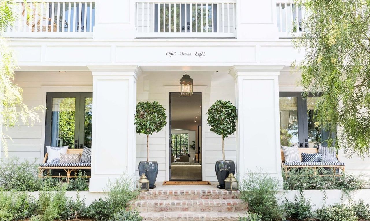 white front porch with benches