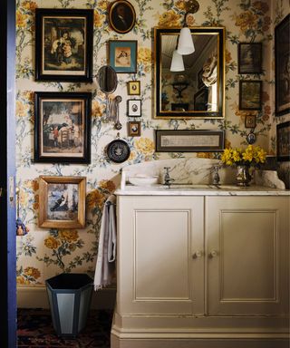 Maximalist bathroom with countertops decorated with a vase of flowers and aa decorative soap dish