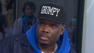 Michael Che wears a hat that says GRUMPY and talks during an interview on Today.