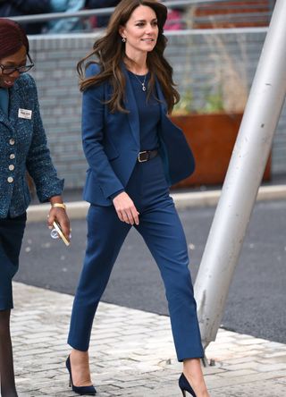 Kate Middleton wearing a blue suit.