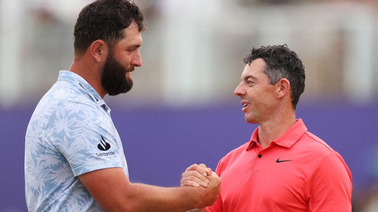 Jon Rahm and Rory McIlroy shake hands