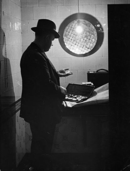 A man with a safe deposit box.