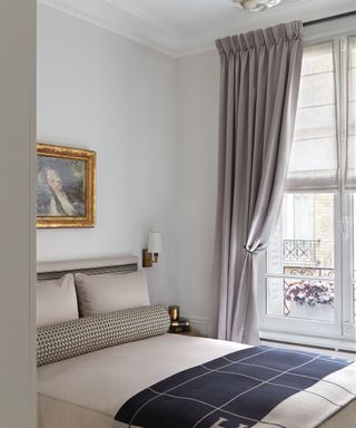neutral bedroom with cream textures and navy