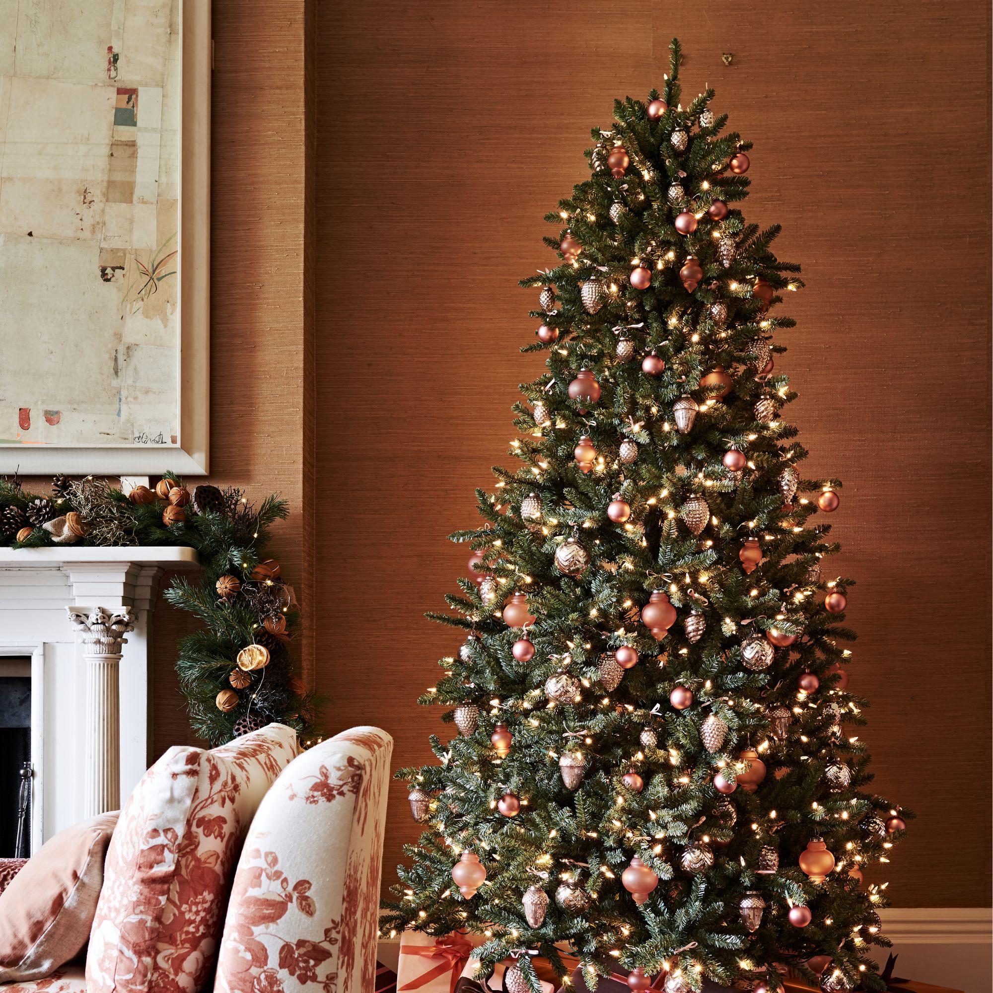 A Ralph Lauren Christmas tree and matching mantlepiece display with copper accents and pinecones