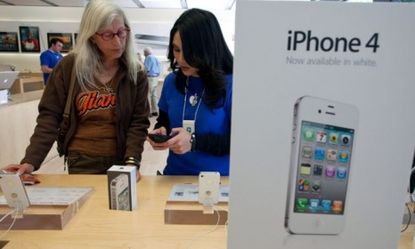 A customer considers an iPhone purchase