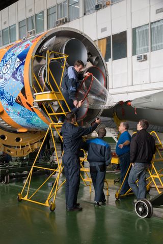 Workers Make Final Pre-Launch Prep to Soyuz