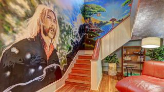 The stairwell at Duane Allman's old house, featuring a mural of Allman