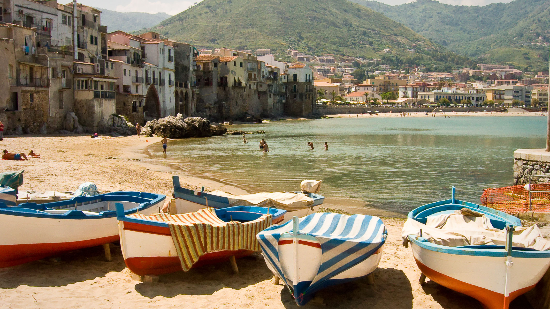 Small rowing boats on a sandy beach