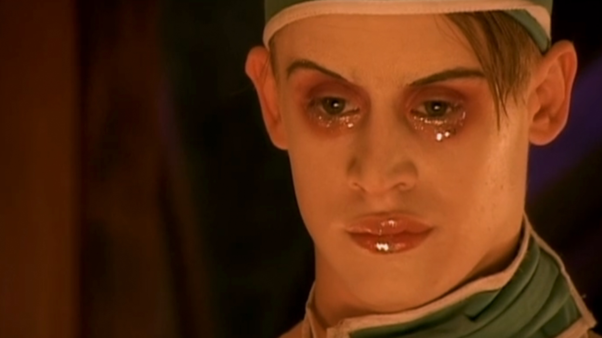 A close up of Macaulay Culkin in make up, in Party Monster. 