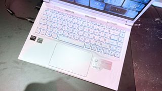 Overhead view of the keyboard deck on the white Acer Nitro V 14 at IFA Berlin 2024