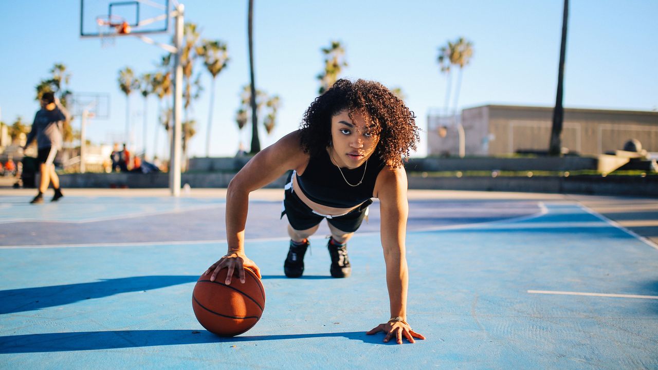 Doing a HIIT workout with a basketball