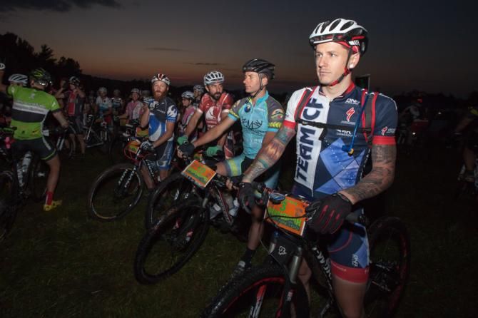 Rob Spreng (Team CF), right, and Andy Rhodes (North Mountain Woodworks/Black Dog Bikes), center, take their positions on the line for the dawn start of the Shenandoah Mountain 100