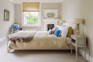 bedroom with original fireplace in Victorian home