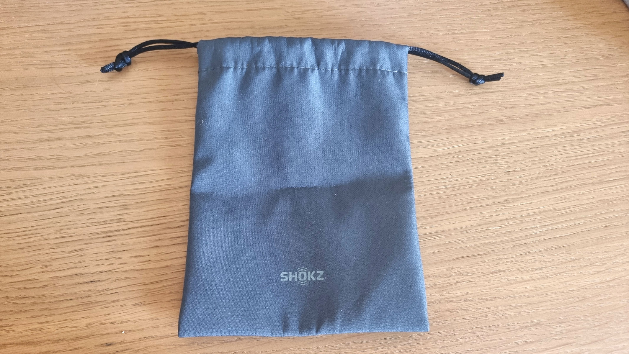A picture of the carrying case for the Shokz Openrun bone conduction headphones