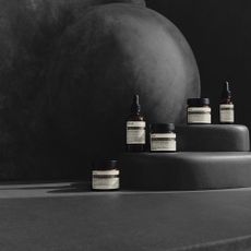 Aesop products on a dark side of the moon setting