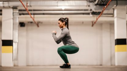 Woman holding a squat position