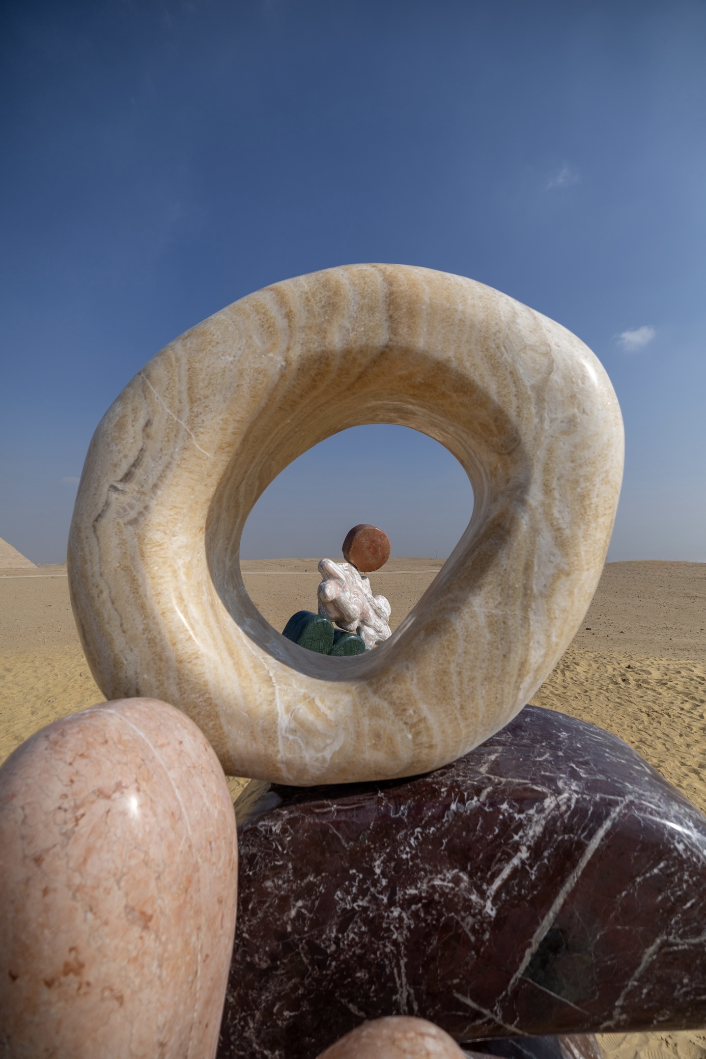 Giza Pyramids with colourful marble installation by Studio Proba