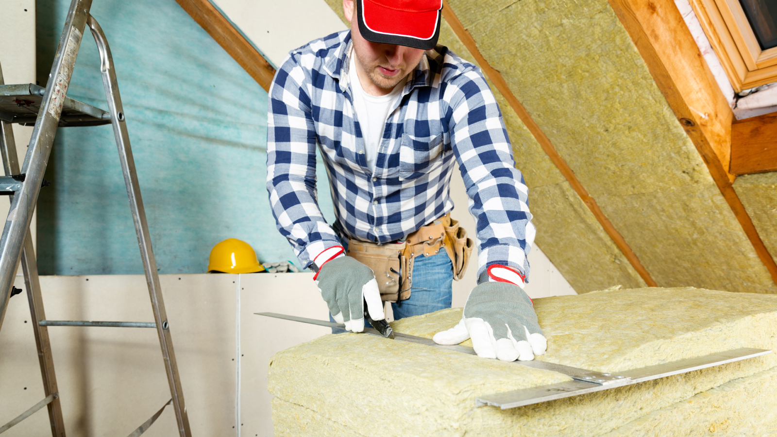 male cutting insulation to go into walls