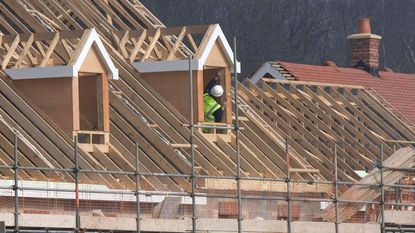 Carpenter building a house 
