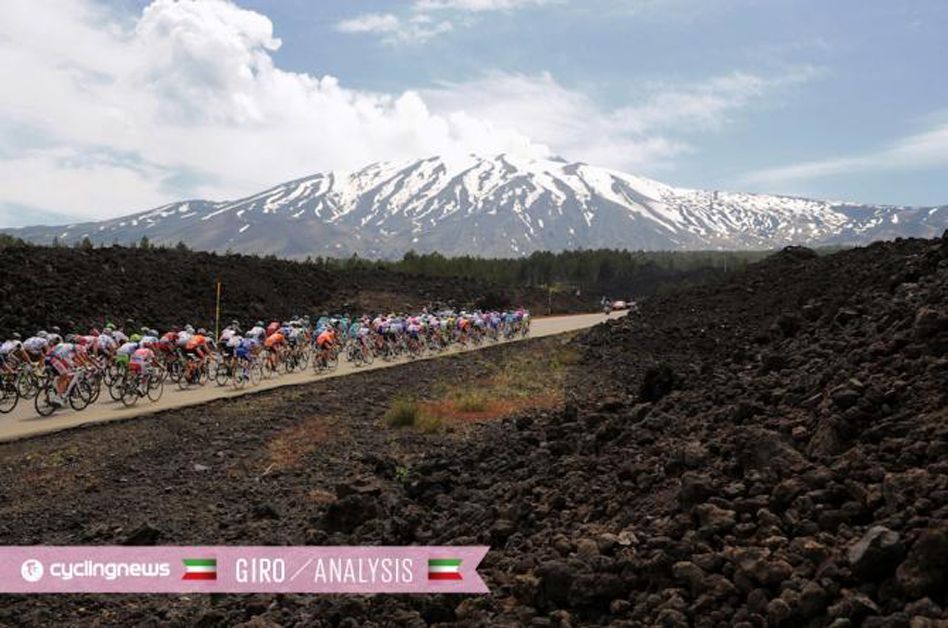 The peloton makes its way towards Mount Etna
