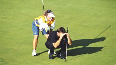 One of the best player-caddie partnerships at work: Nick Faldo and Fanny Sunesson read a put together GettyImages-702080341
