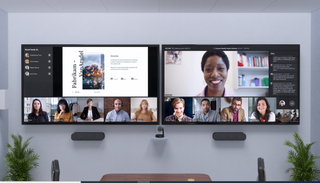 New gallery layout on Microsoft Teams, showing on two TVs on a wall