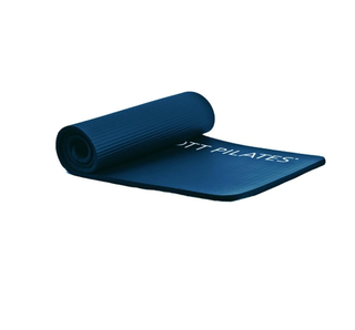 A thick Pilates mat on a plain white background.