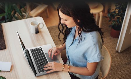 Acer Chromebook 514 being used by a woman at a desk