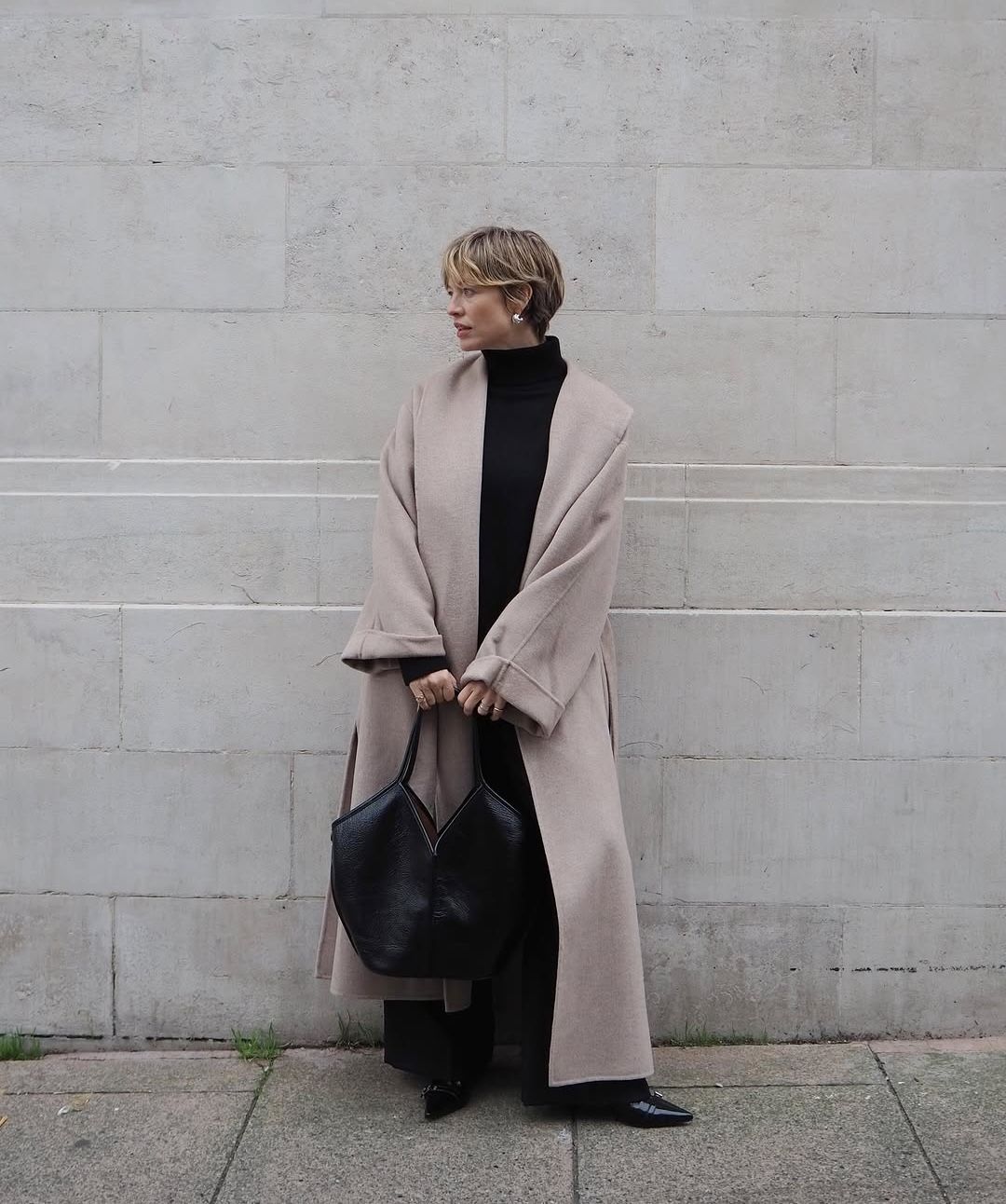 Alexis in mock neck jumper and wool coat