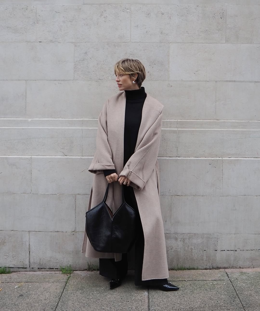 Alexis in mock neck jumper and wool coat
