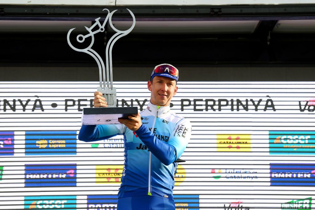 PERPIGNAN FRANCE MARCH 22 Kaden Groves of Australia and Team BikeExchange Jayco holds up his trophy and celebrates winning the stage on the podium ceremony after the 101st Volta Ciclista a Catalunya 2022 Stage 2 a 2024km stage from LEscala to Perpignan VoltaCatalunya101 WorldTour on March 22 2022 in Perpignan France Photo by David RamosGetty Images