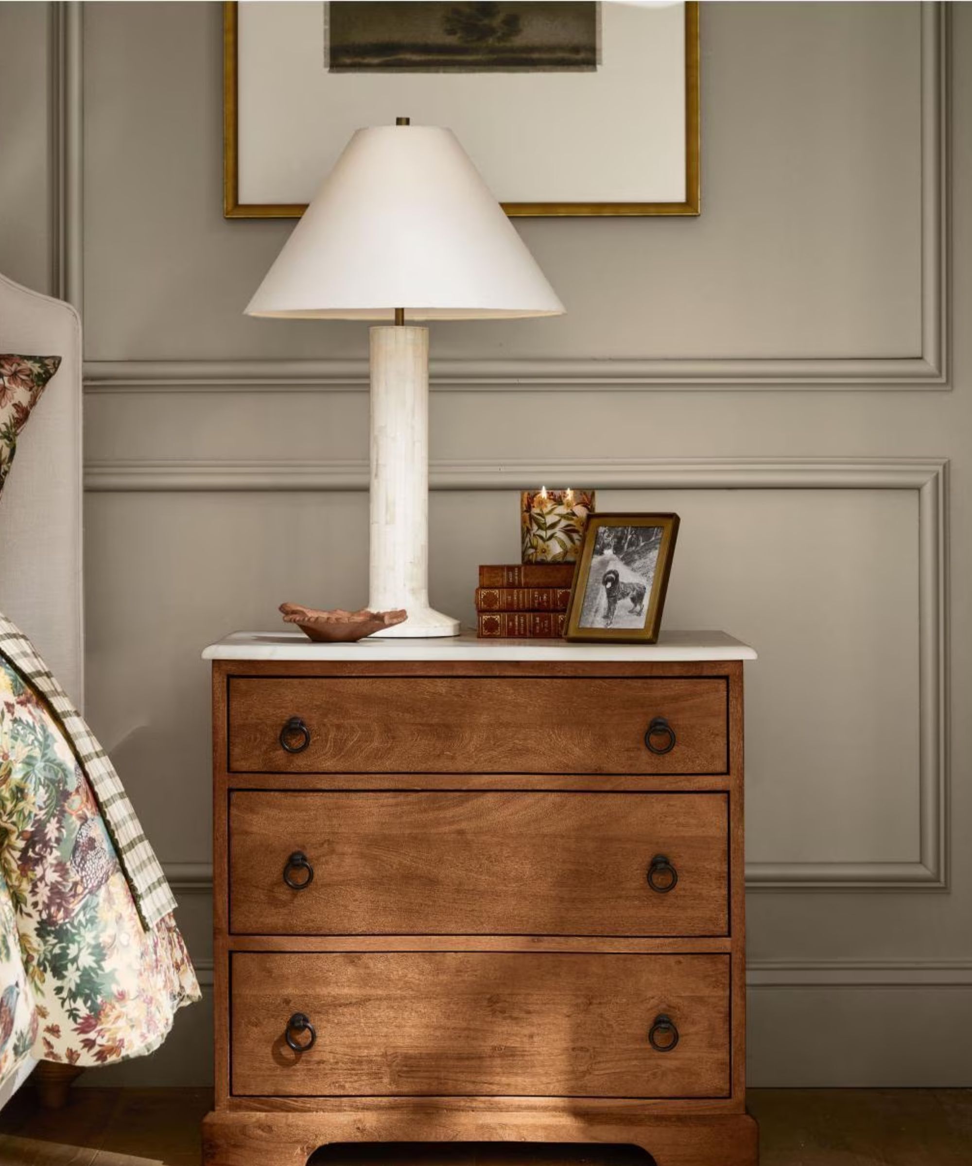 Classic wooden bedside table and white lamp