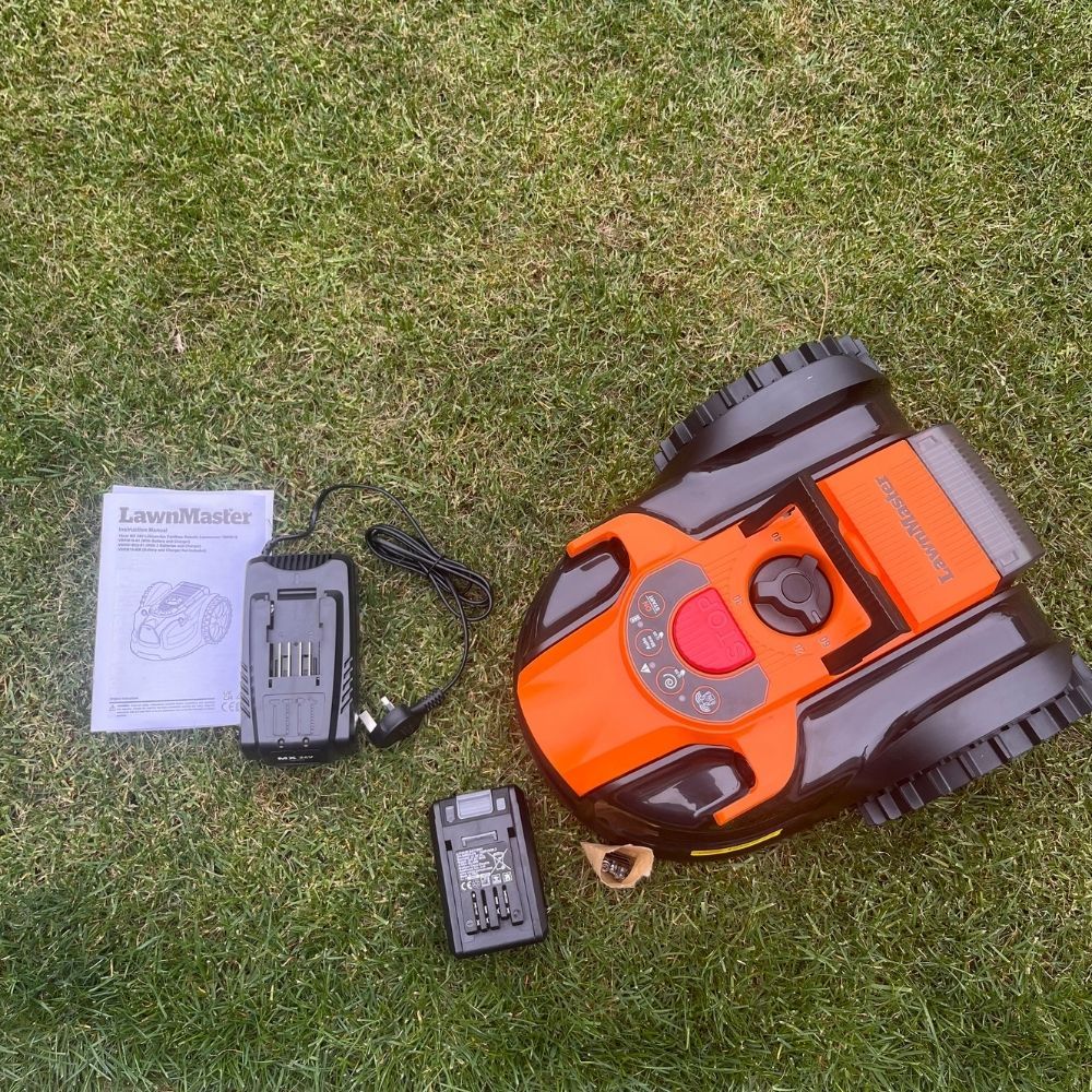 LawnMaster OcuMow 16 Vision Robot Lawnmower out of the box with battery, charger and instruction manual