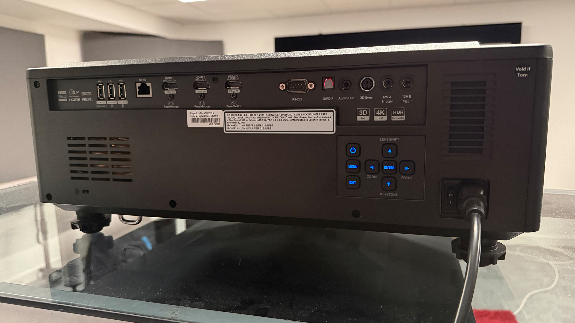 Optoma UHZ78LV home cinema projector, rear of unit showing connections and controls