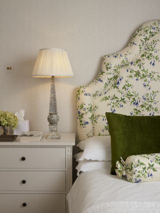 A bedside lamp emitting warm white light