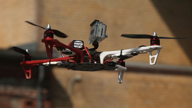 BERLIN, GERMANY - MAY 06:A quadrocopter drone flown remotely by a participant and equipped with a video camera flies on the first day of the re:publica 2013 conferences on May 6, 2013 in Berl