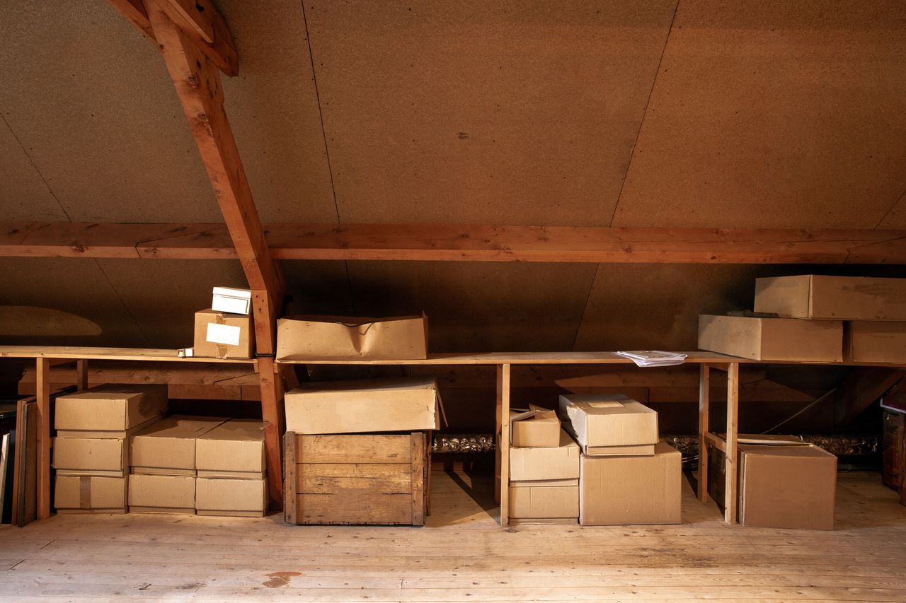 an attic with storage boxes in 