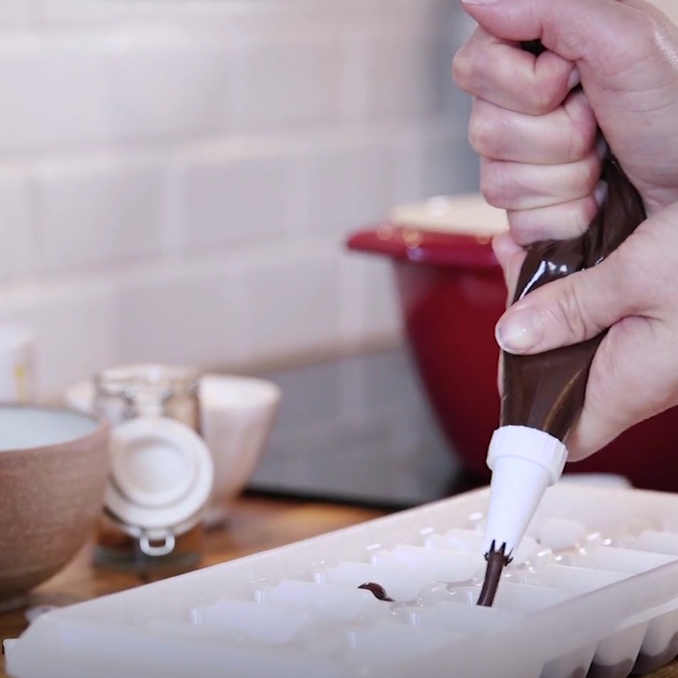 hot chocolate with tray and lolly sticks