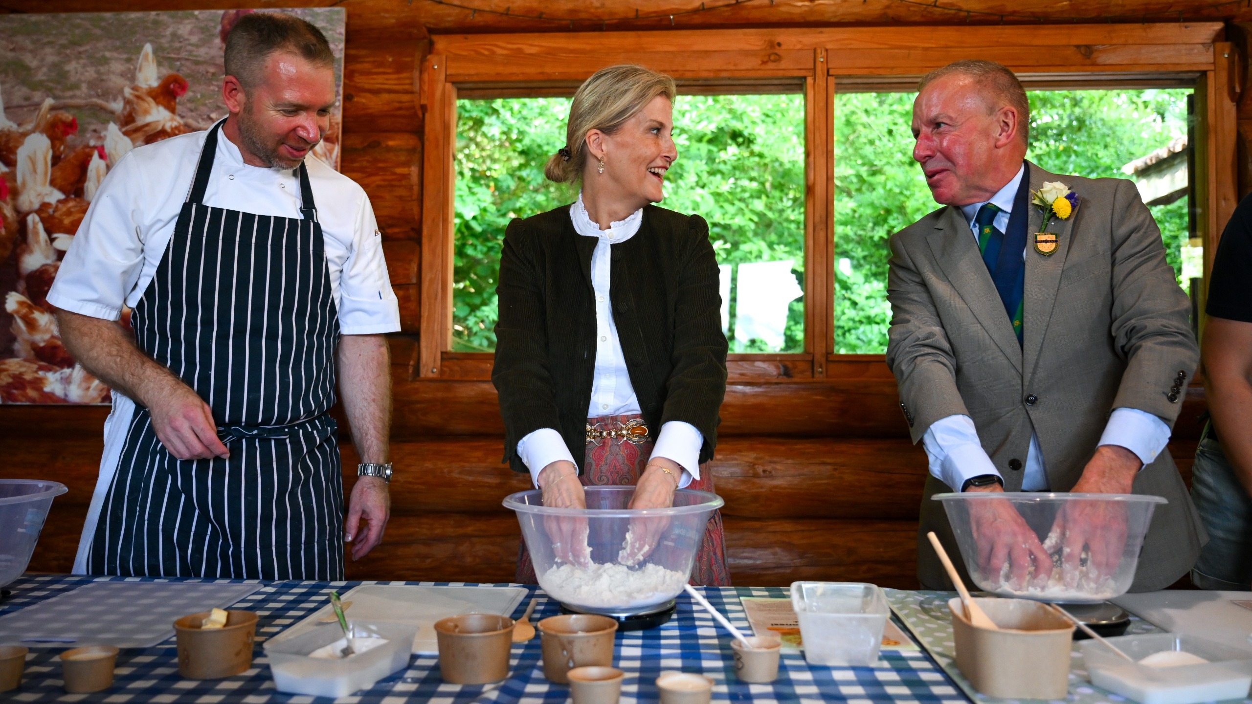 Sophie, Duchess of Edinburgh makes scones at the Farmwise area with chef Stefan Harris and Devon County Show President John Lee at the Devon County Show at Westpoint arena, on May 21, 2026
