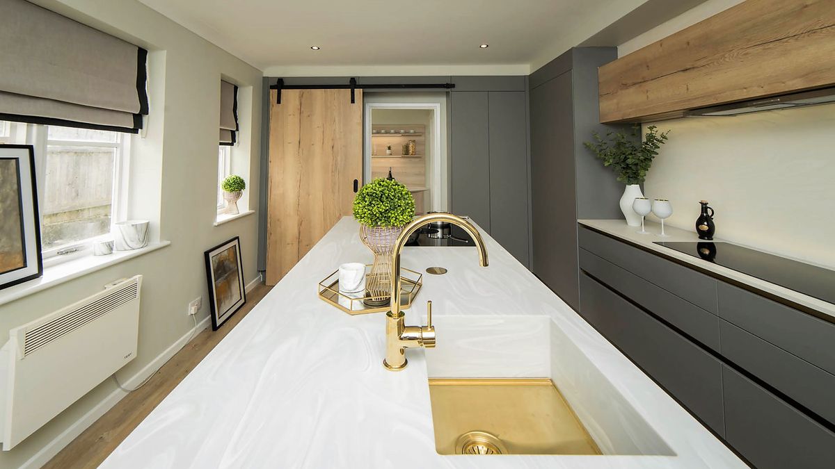 long kitchen with large white kitchen island