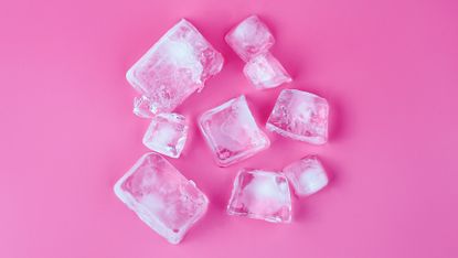 Directly Above Shot Of Ice Cubes Over Pink Background, Frozen Skin Sticks