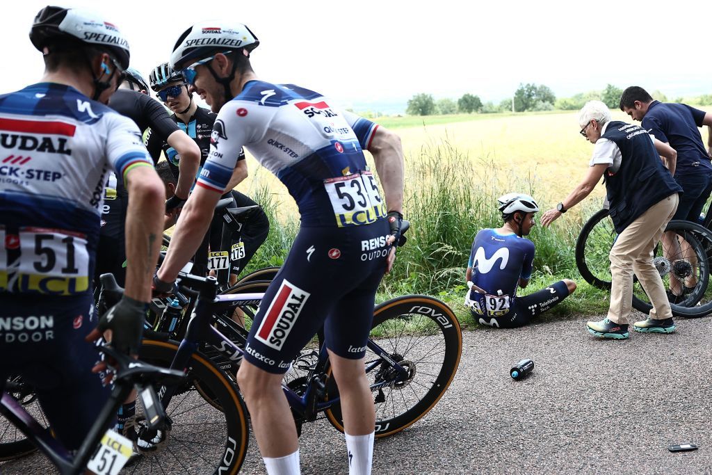 Soudal Quick Steps French rider Remi Cavagna 2ndL and Soudal Quick Steps French rider Julian Alaphilippe L react as Teams Spanish rider Jorge Arcas C Movistar receives medical assistance after a crash in the pack involving several riders during the third stage of the 75th edition of the Criterium du Dauphine cycling race 1945 kms between MonistrolSurLoire and Le Coteau centraleastern France on June 6 2023 Photo by AnneChristine POUJOULAT AFP Photo by ANNECHRISTINE POUJOULATAFP via Getty Images