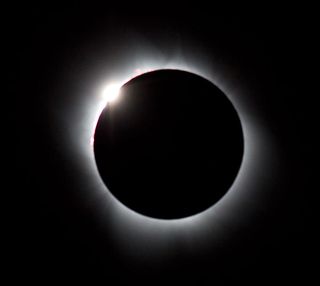 The Sun peeking from behind the Moon during a total solar eclipse is called the Diamond Ring effect.