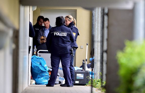 Police outside of the apartment where explosives were found.