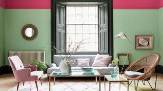 Abstract living room with pink and green walls and stripy carpet