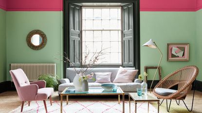 Abstract living room with pink and green walls and stripy carpet