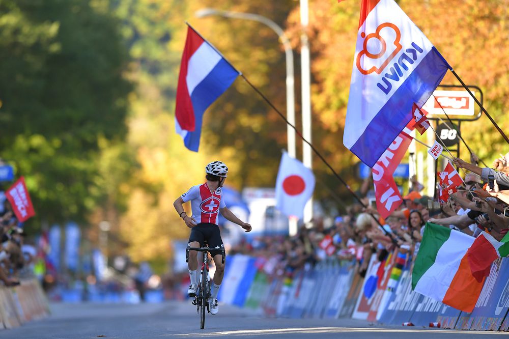 Marc Hirschi of Switzerland looks back as he nears the finish of the U23 road race